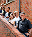 %_tempFileNamefamily-on-staircase-1%