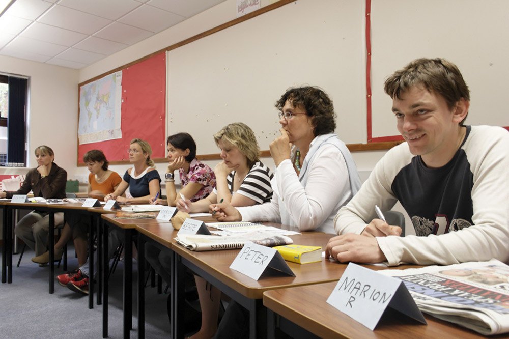 %_tempFileNameadults-in-class%