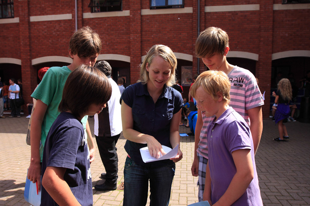 %_tempFileNameteignmouth-campus-staff-explaining-students-2%