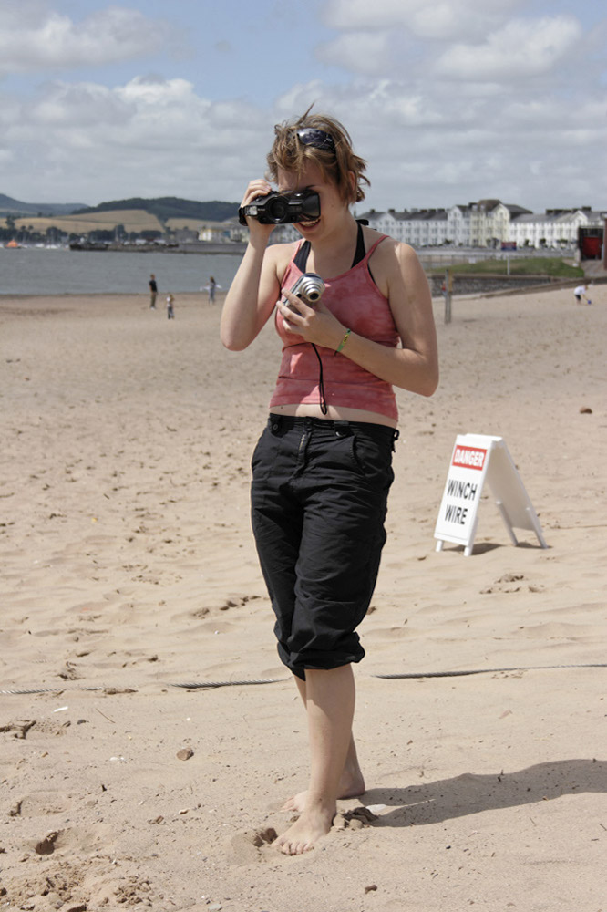 %_tempFileNamefilming-girl-on-the-beach%