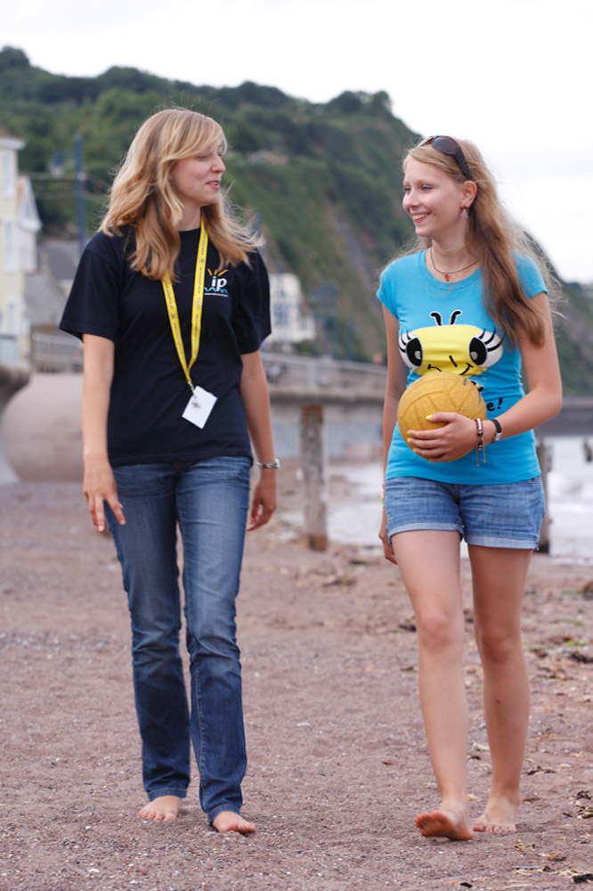 %_tempFileNamegirl-with-staff-at-the-beach-12%