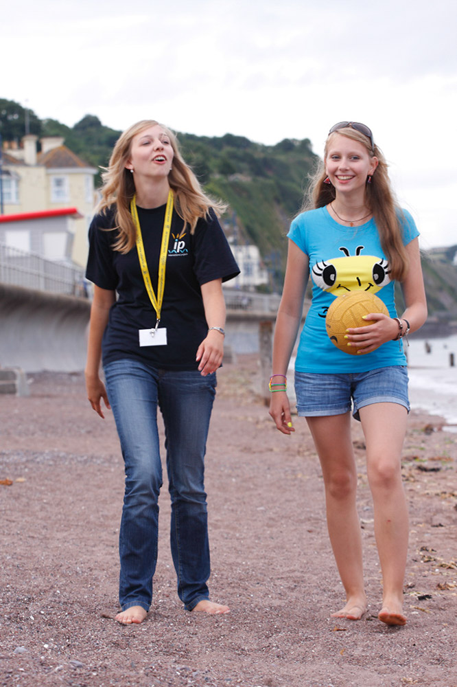 %_tempFileNamegirl-with-staff-at-the-beach-14%