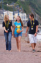 %_tempFileNamegirl-with-staff-at-the-beach-1%