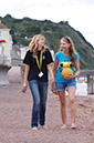 %_tempFileNamegirl-with-staff-at-the-beach-10%