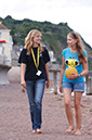 %_tempFileNamegirl-with-staff-at-the-beach-11%