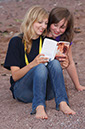 %_tempFileNamegirl-with-staff-at-the-beach-16%