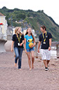 %_tempFileNamegirl-with-staff-at-the-beach-4%