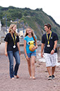 %_tempFileNamegirl-with-staff-at-the-beach-6%