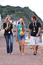 %_tempFileNamegirl-with-staff-at-the-beach-7%