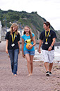 %_tempFileNamegirl-with-staff-at-the-beach-9%