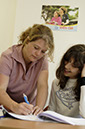 %_tempFileNamegirl-with-teacher-2%
