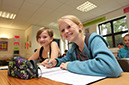 %_tempFileNamesmiling-girls-in-class%