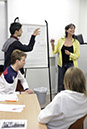 %_tempFileNameteacher-next-to-the-sheet_4%