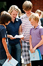 %_tempFileNamearrival-staff-with-students-2%
