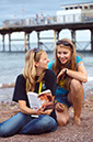 %_tempFileNamereading-on-beach-2%