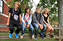 %_tempFileNamestudents-sitting-on-bannister-9%