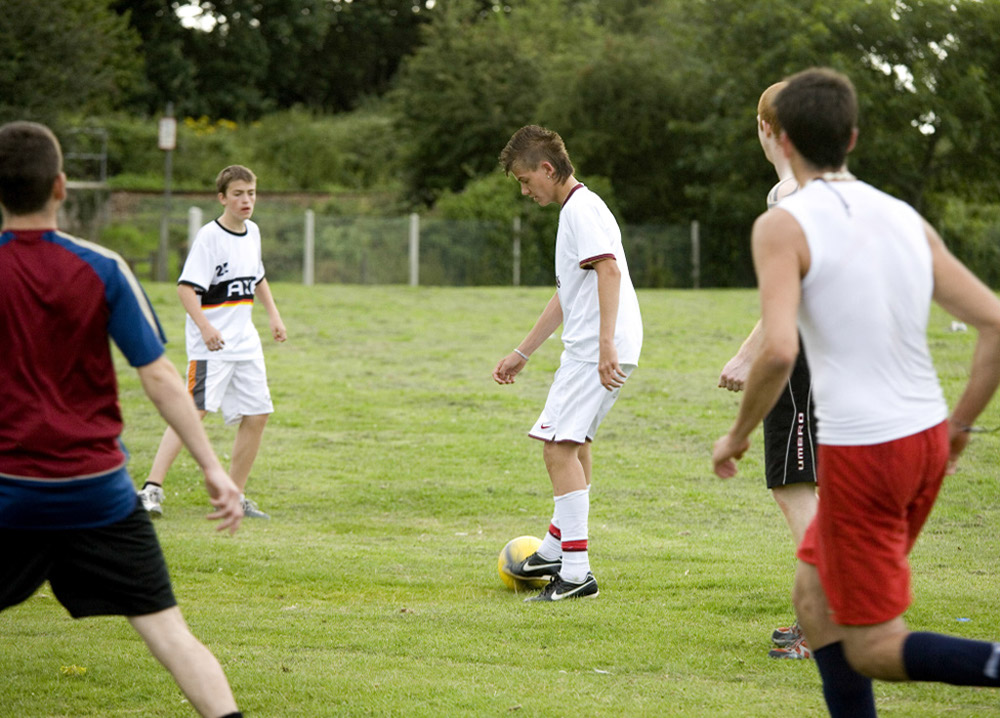 %_tempFileNameplaying-football-3%