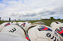 %_tempFileNamefootballs-and-field%